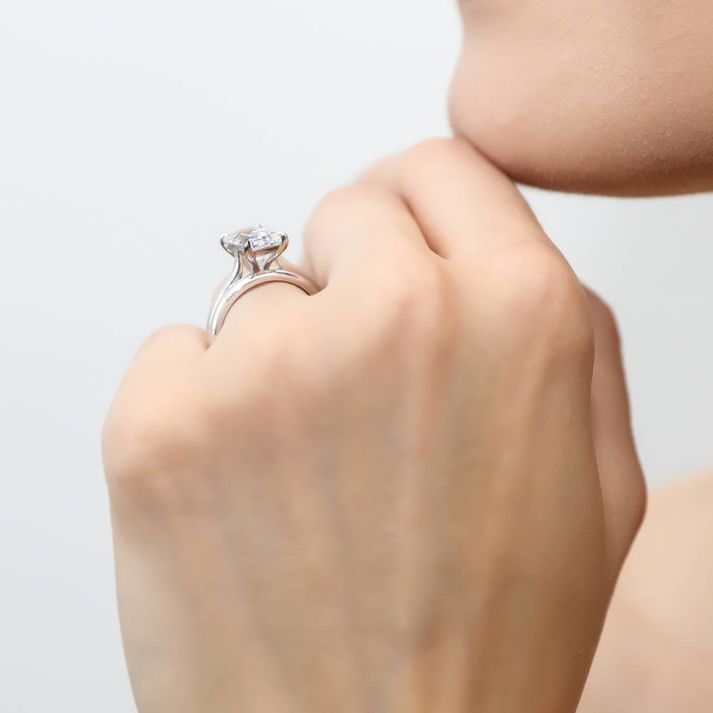 Model wearing Solitaire 2.6ct Emerald Cut CZ Ring Set in Sterling Silver, 3 of 11