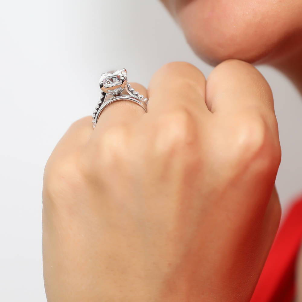 Model wearing Solitaire 5.5ct Oval CZ Ring Set in Sterling Silver, 2 of 12