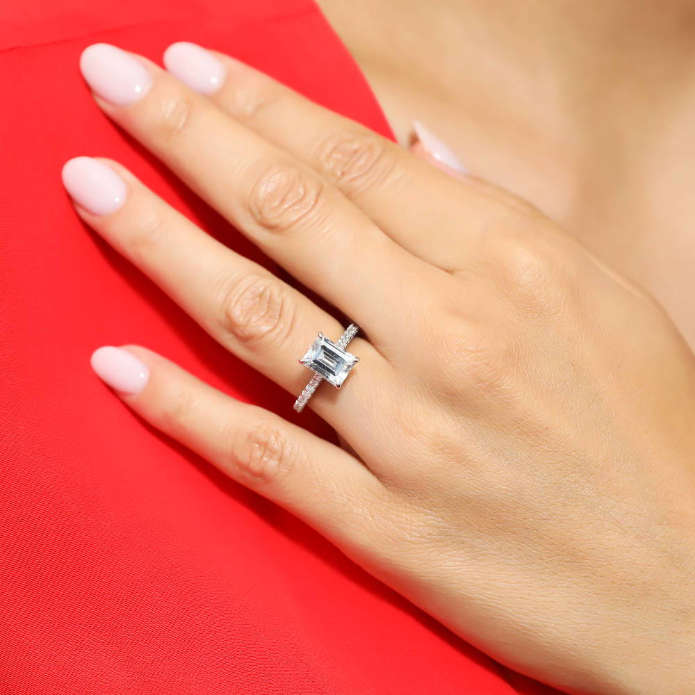 Model wearing Solitaire 2.6ct Emerald Cut CZ Ring Set in Sterling Silver, 9 of 10