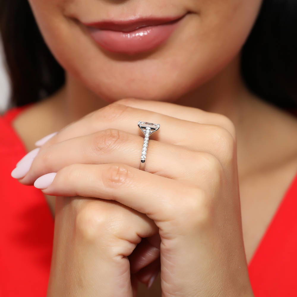Model wearing Solitaire 2.6ct Emerald Cut CZ Ring Set in Sterling Silver, 9 of 11