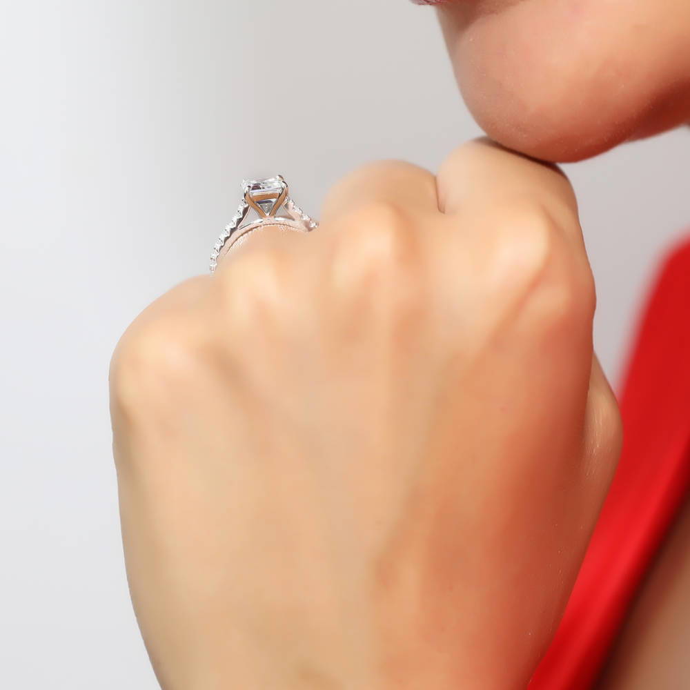 Model wearing Solitaire 2.6ct Emerald Cut CZ Ring Set in Sterling Silver, 7 of 11