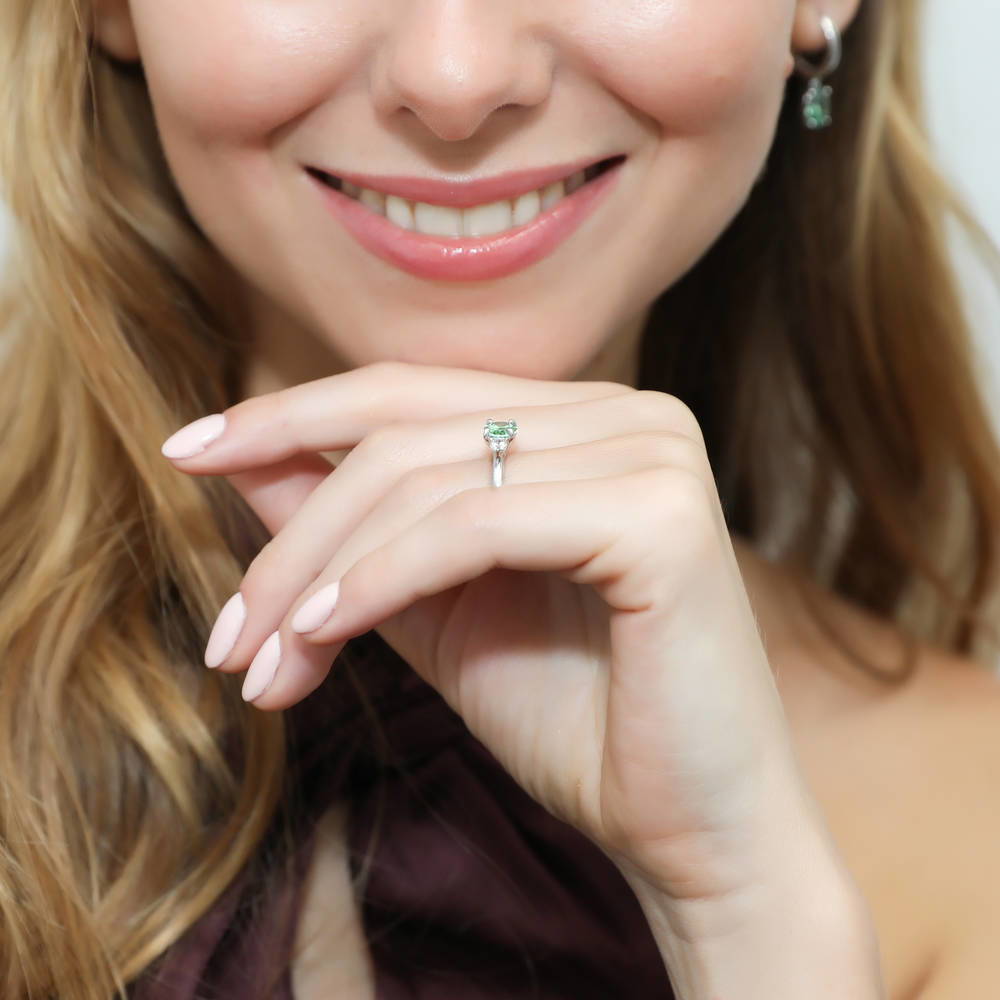 Model wearing 3-Stone East-West Green Oval CZ Ring in Sterling Silver, 6 of 7