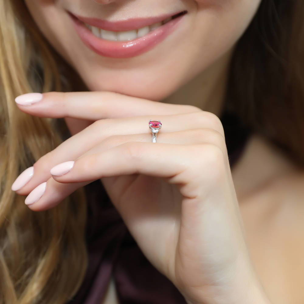Model wearing 3-Stone East-West Red Oval CZ Ring in Sterling Silver, 6 of 7