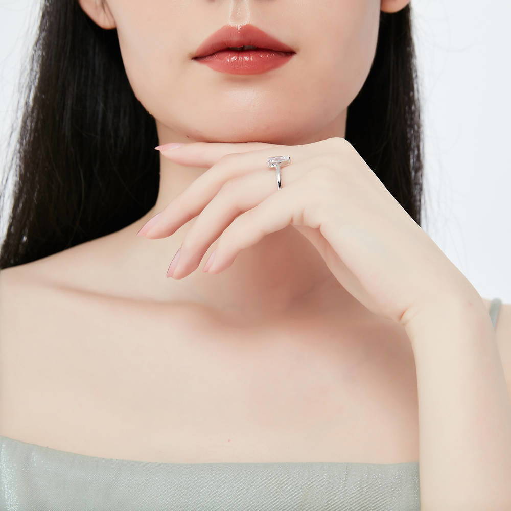 Model wearing Solitaire 1.8ct Pear CZ Ring Set in Sterling Silver, 8 of 14