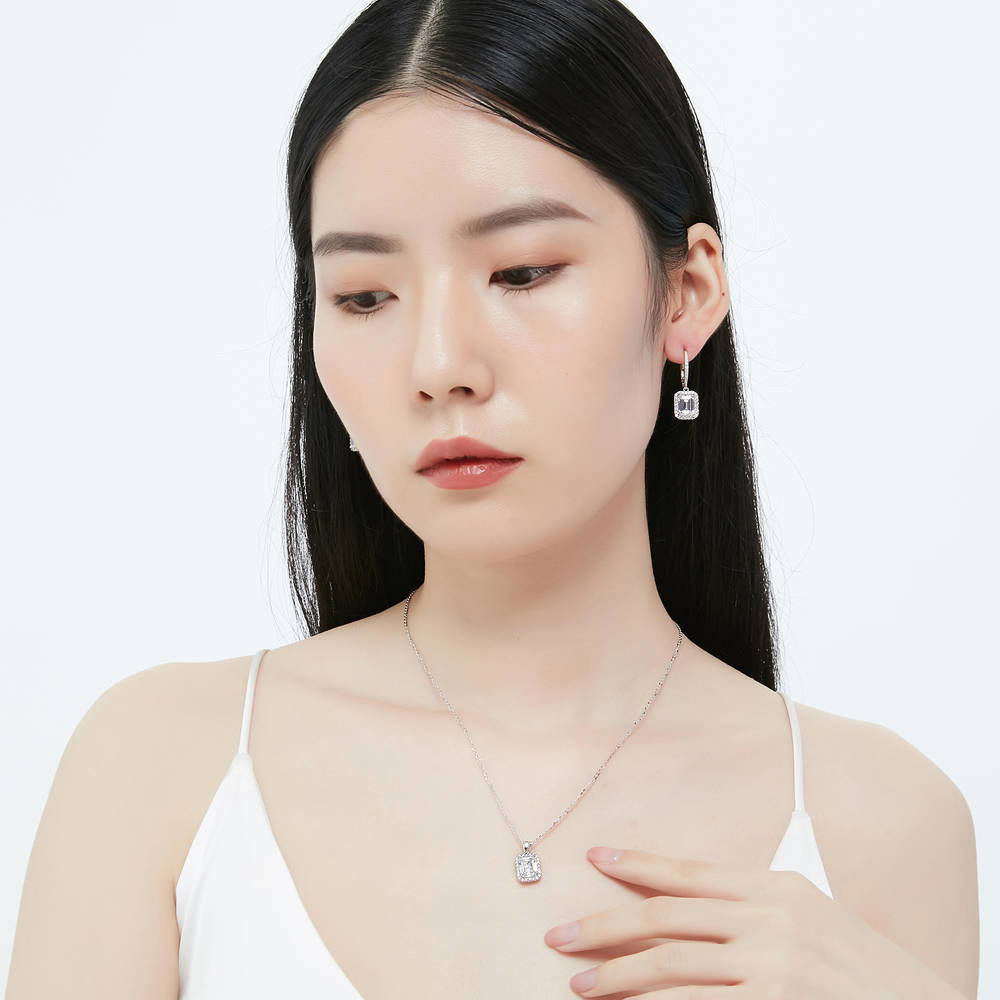 Model wearing Halo Emerald Cut CZ Necklace and Earrings Set in Sterling Silver, 2 of 10
