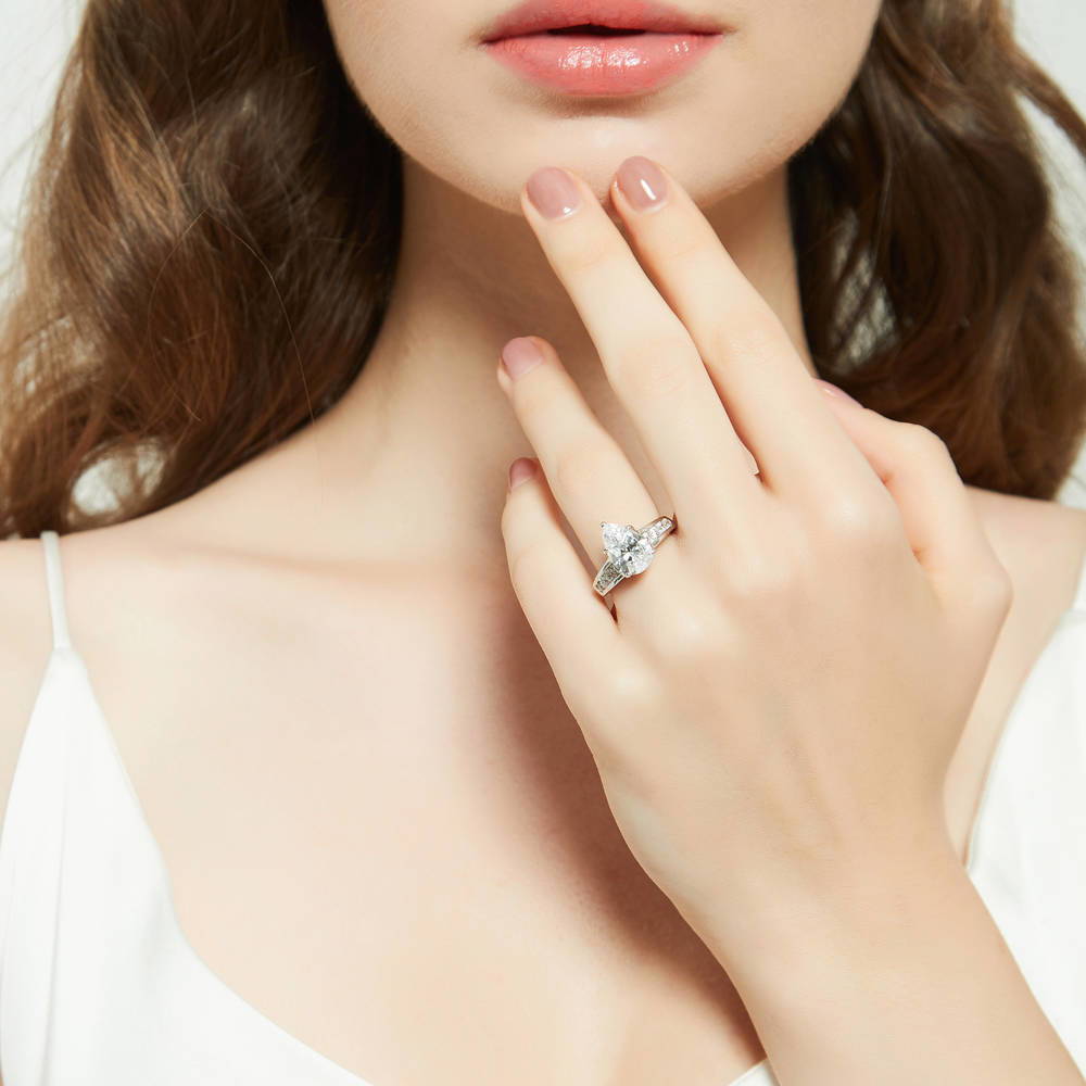 Model wearing Solitaire 3ct Pear CZ Ring Set in Sterling Silver, 10 of 17