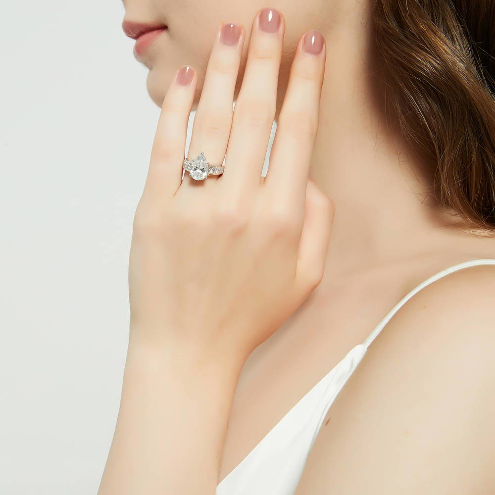 Model wearing Solitaire 3ct Pear CZ Ring Set in Sterling Silver, 9 of 17