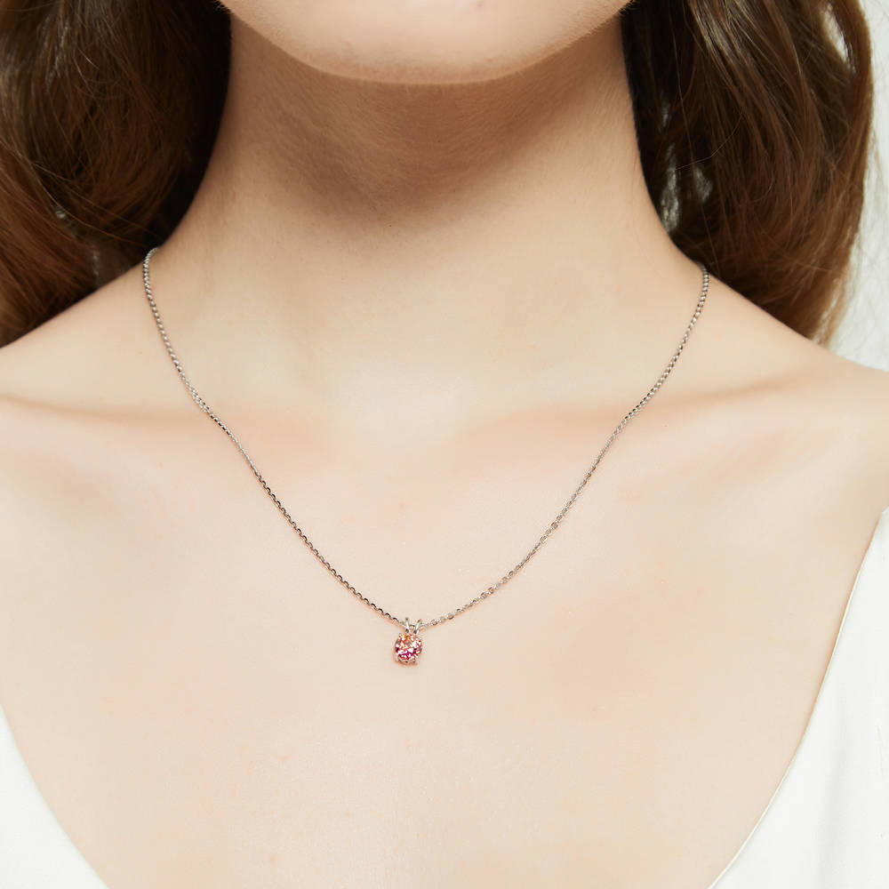 Model wearing Kaleidoscope Solitaire 0.8ct CZ Necklace in Sterling Silver, Red Orange Color