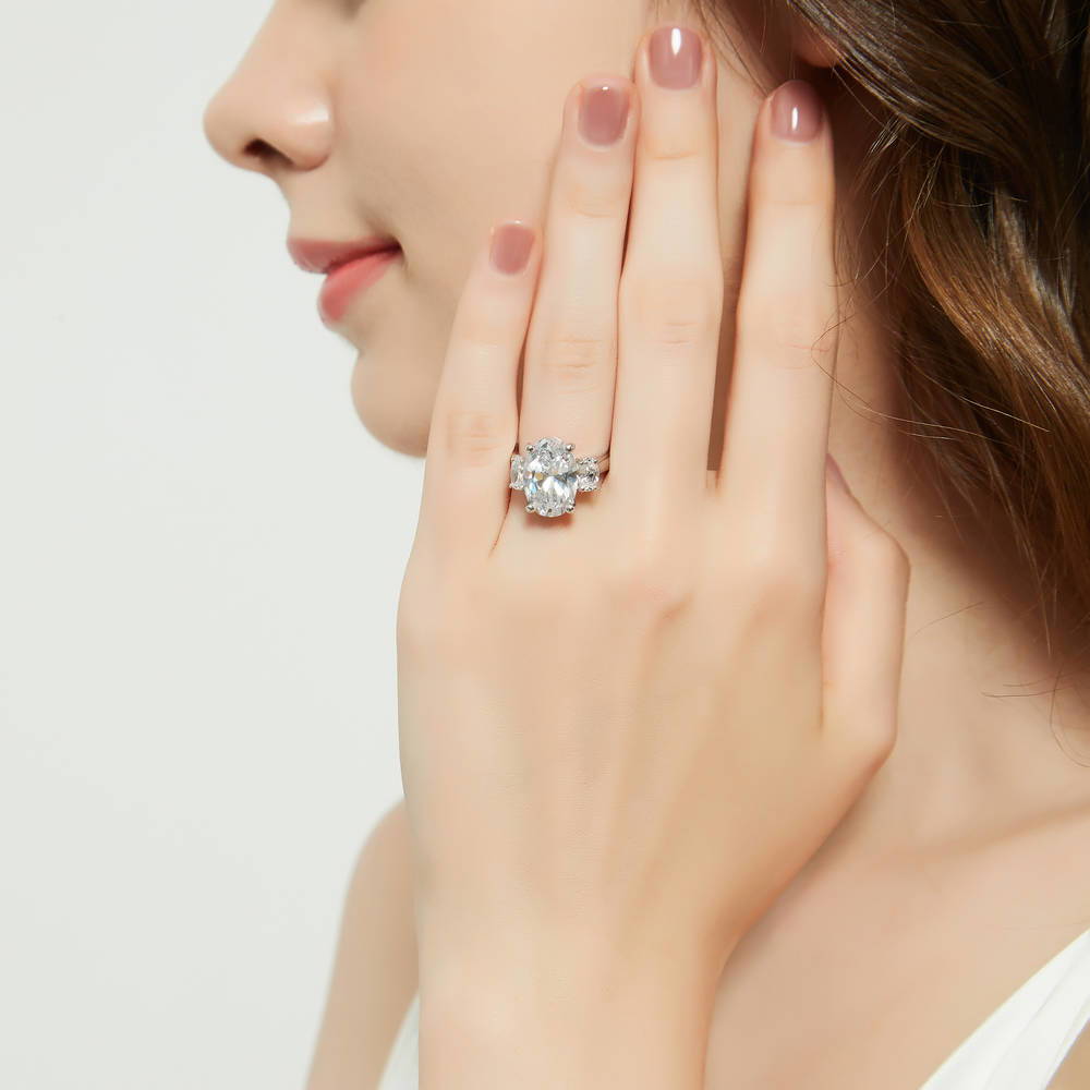 Model wearing 3-Stone Oval CZ Statement Ring in Sterling Silver, 3 of 13