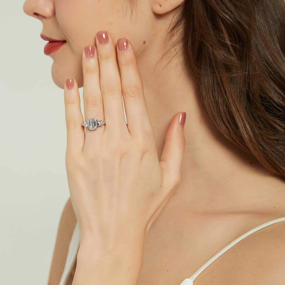 Model wearing 3-Stone Step Emerald Cut CZ Ring in Sterling Silver, 3 of 8