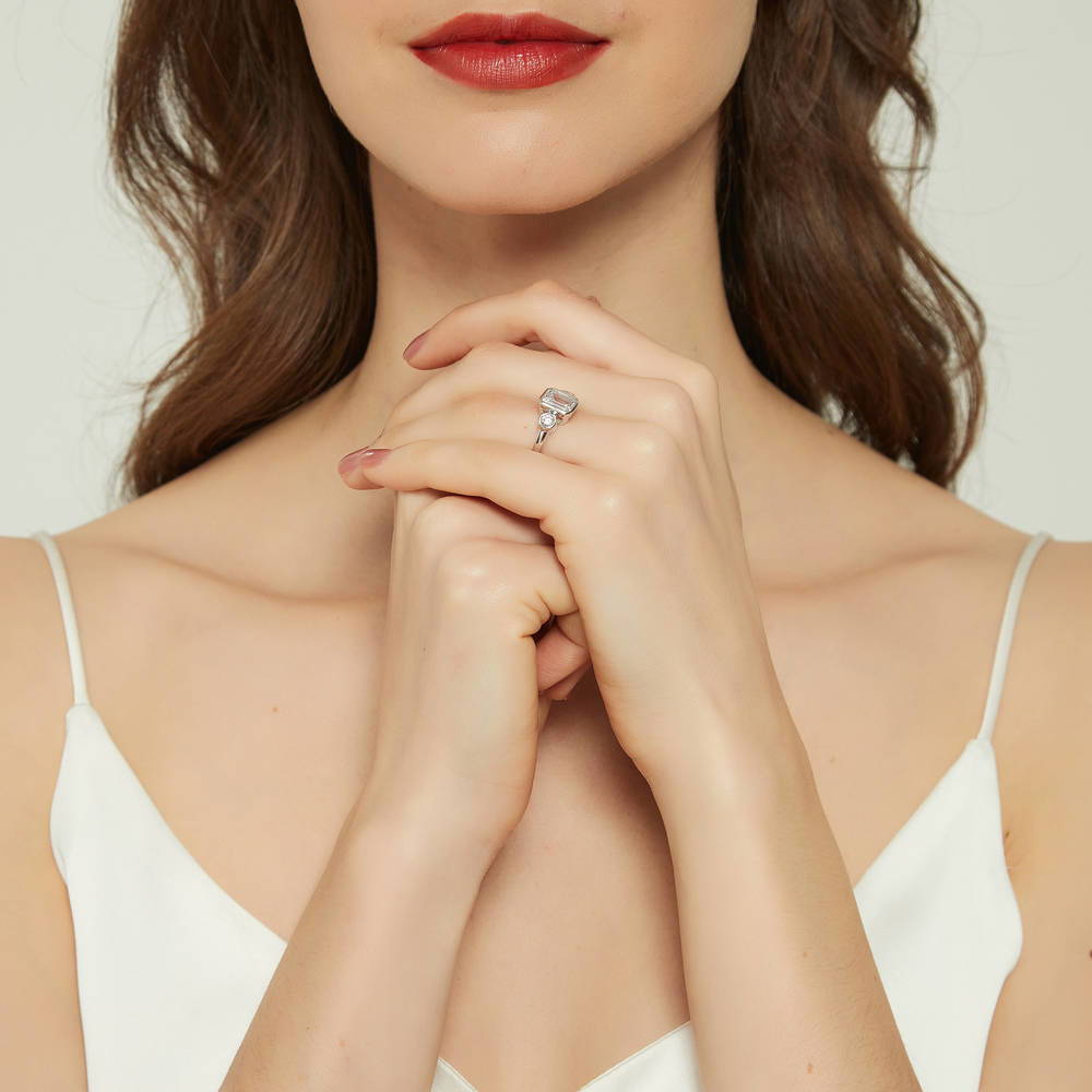 Model wearing 3-Stone Step Emerald Cut CZ Ring in Sterling Silver, 6 of 8