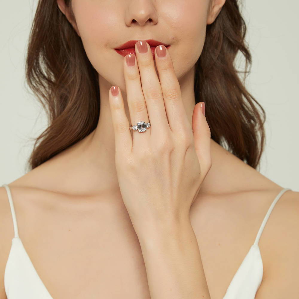 Model wearing 3-Stone Step Emerald Cut CZ Ring in Sterling Silver, 2 of 8