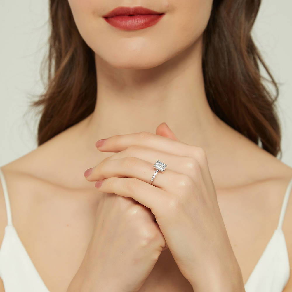 Model wearing Solitaire Art Deco 2.1ct Emerald Cut CZ Ring Set in Sterling Silver, 11 of 16