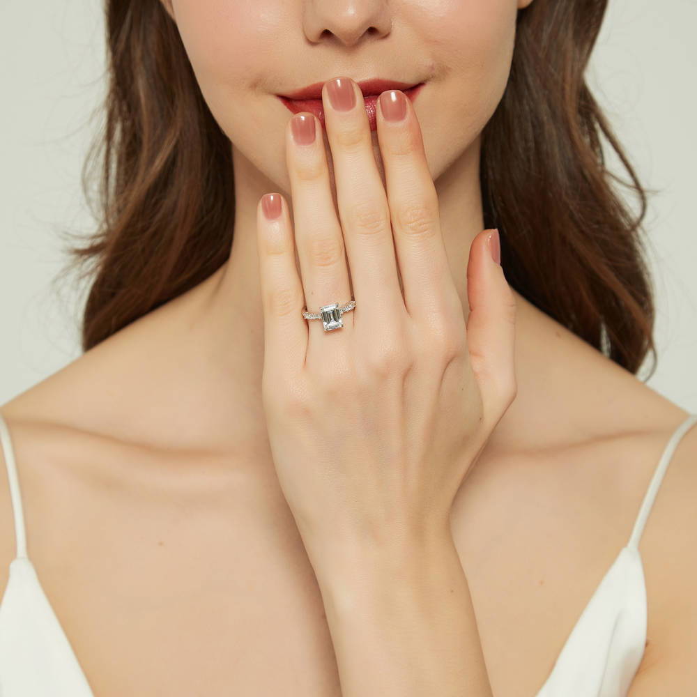 Model wearing Solitaire Art Deco 2.1ct Emerald Cut CZ Ring Set in Sterling Silver, 9 of 16
