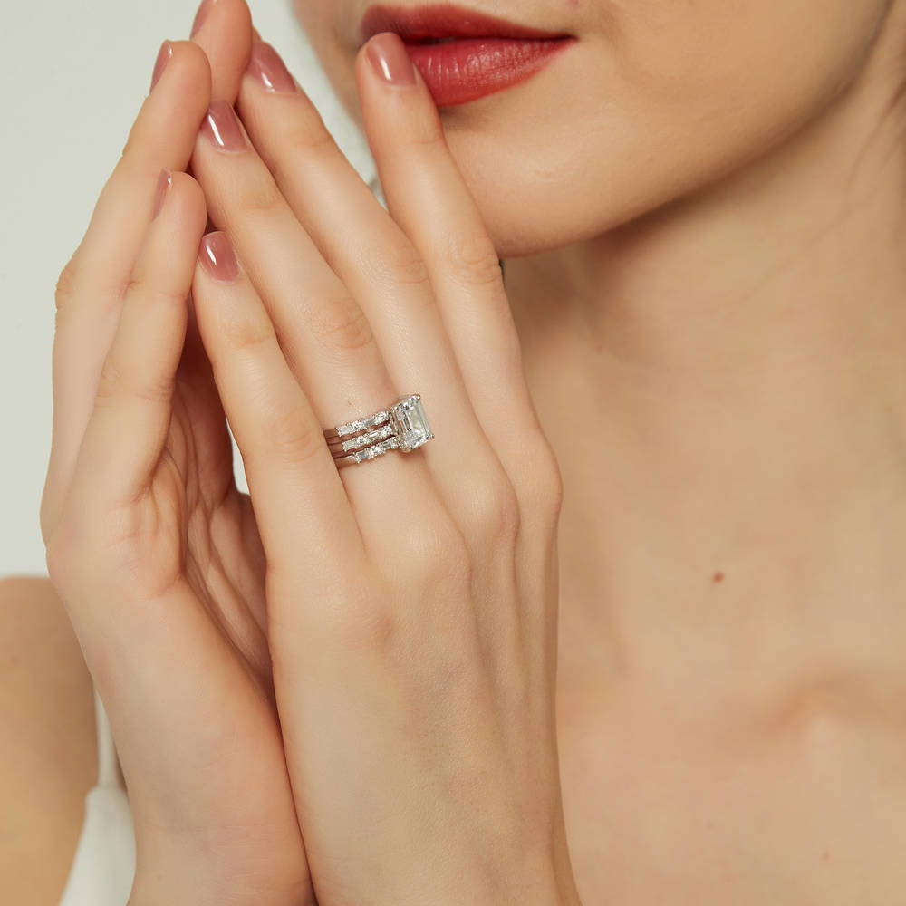 Model wearing Solitaire Art Deco 2.1ct Emerald Cut CZ Ring Set in Sterling Silver, 5 of 16