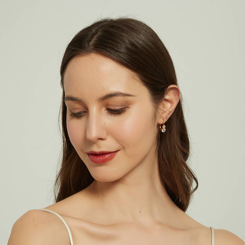 Model wearing 2-Stone CZ Leverback Earrings in Sterling Silver, Yellow Gold Flashed