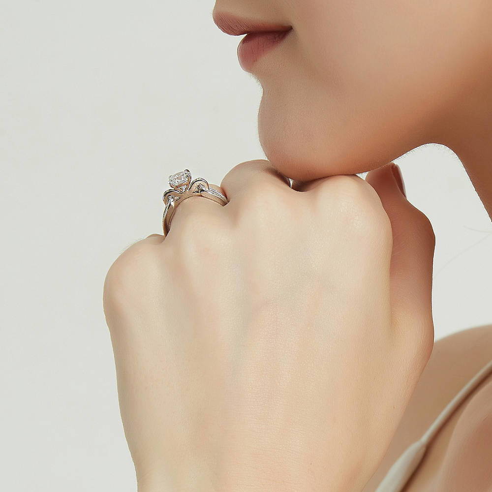 Model wearing Solitaire Interlocking 1.25ct Round CZ Ring in Sterling Silver, 7 of 8