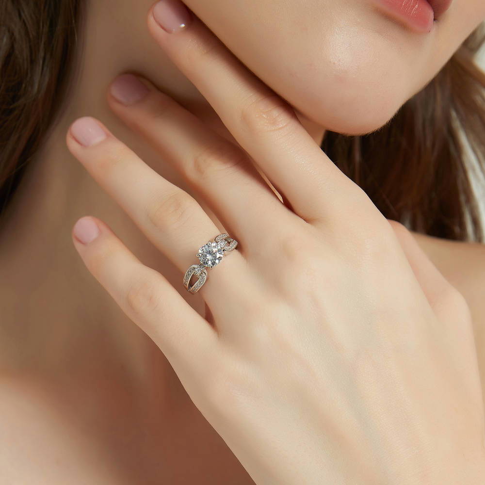Model wearing Solitaire Interlocking 1.25ct Round CZ Ring in Sterling Silver, 3 of 8