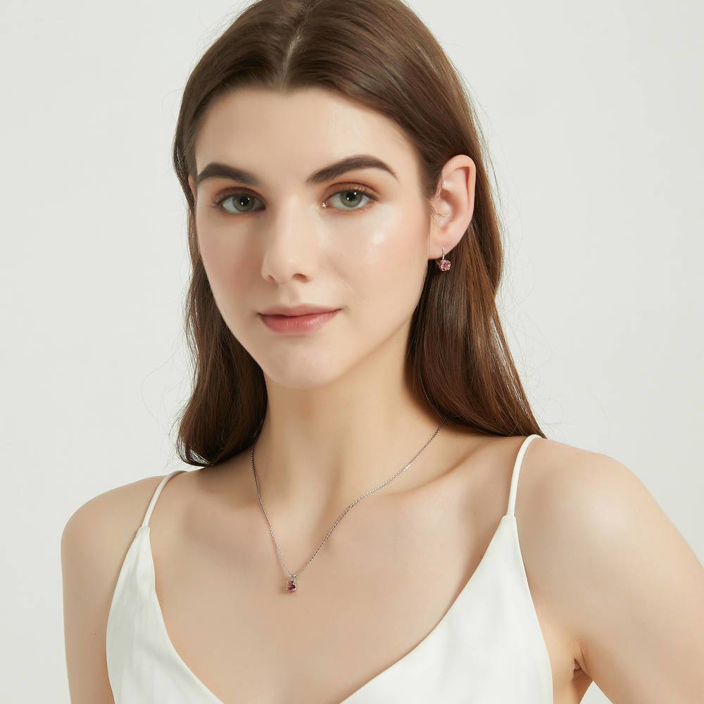 Model wearing Kaleidoscope Solitaire 0.8ct CZ Necklace in Sterling Silver, Red Orange Color