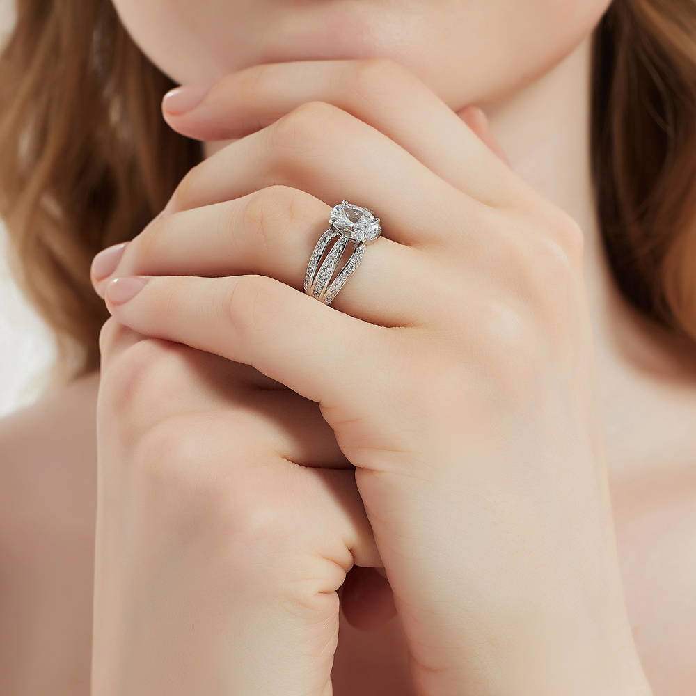 Model wearing Solitaire 1.8ct Oval CZ Ring in Sterling Silver, 6 of 8