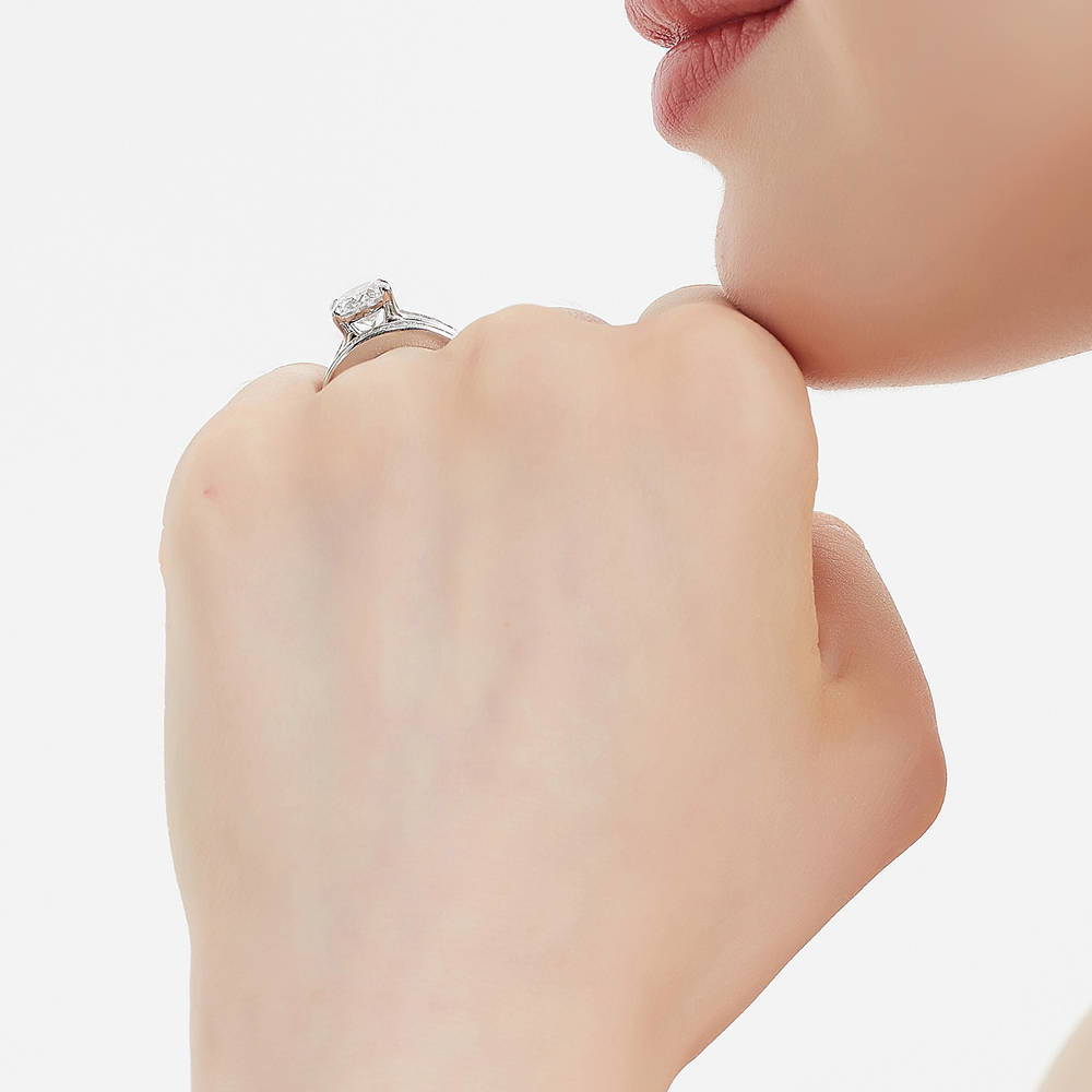 Model wearing Solitaire 2.5ct Oval CZ Ring Set in Sterling Silver, 7 of 16