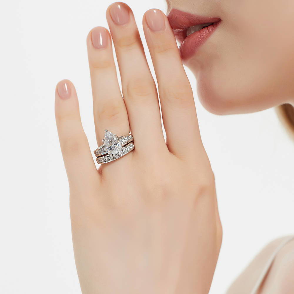 Model wearing Solitaire 3ct Pear CZ Ring Set in Sterling Silver, 2 of 17