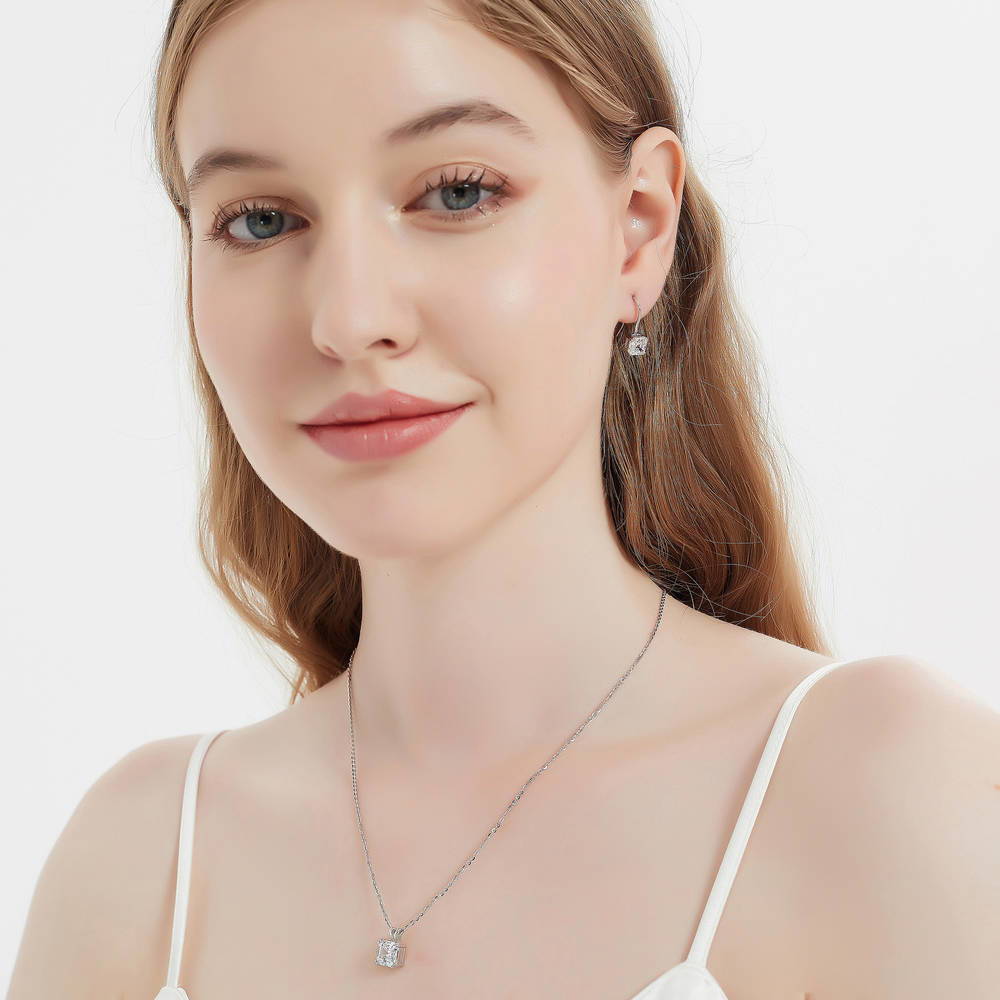 Model wearing Solitaire Asscher CZ Necklace and Earrings Set in Sterling Silver, 5 of 16