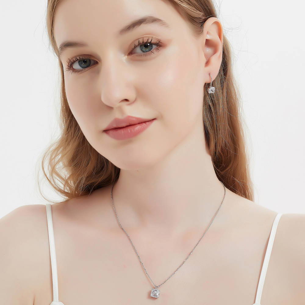 Model wearing Solitaire Asscher CZ Necklace and Earrings Set in Sterling Silver, 2 of 16