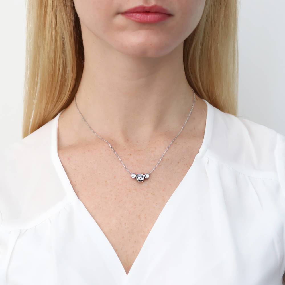Model wearing 3-Stone Cushion CZ Necklace and Hoop Earrings Set in Sterling Silver, 6 of 11