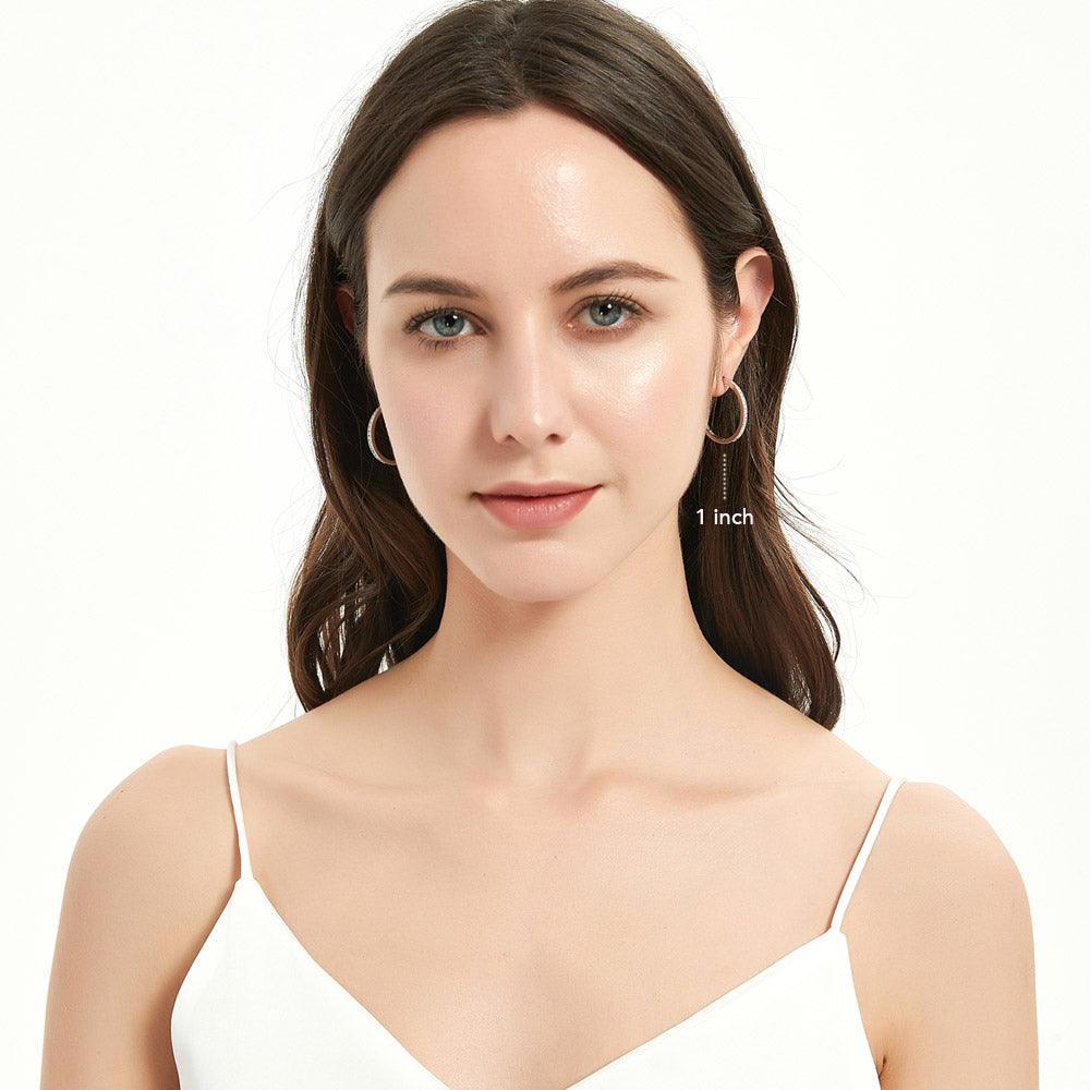 Model wearing Bar CZ Small Hoop Earrings in Sterling Silver, 1 inch