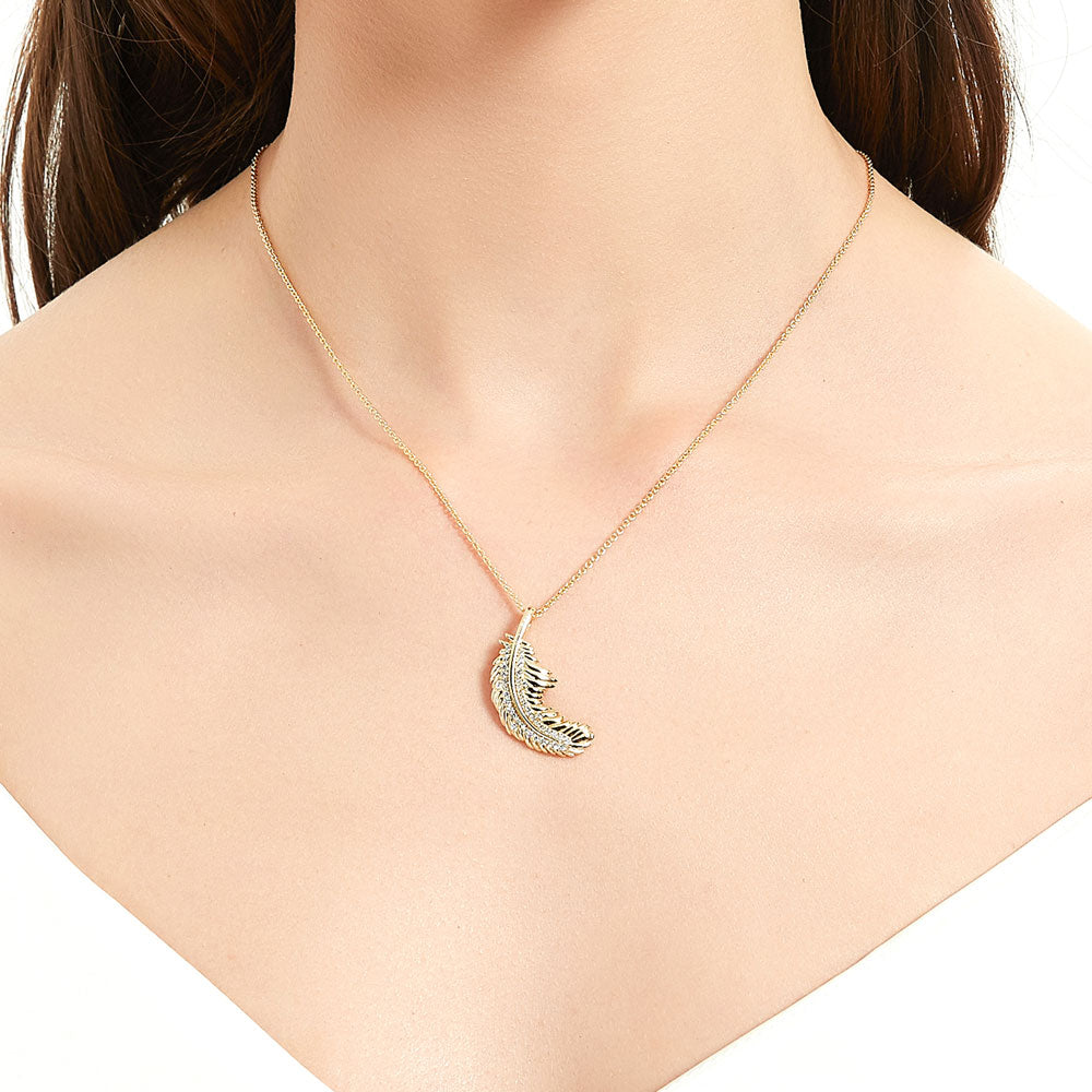 Model wearing Feather CZ Necklace and Earrings Set in Gold Flashed Sterling Silver, 7 of 11