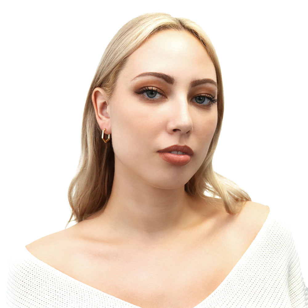 Model wearing Hexagon CZ Small Inside-Out Hoop Earrings in Sterling Silver 0.8 inch, Yellow Gold Flashed