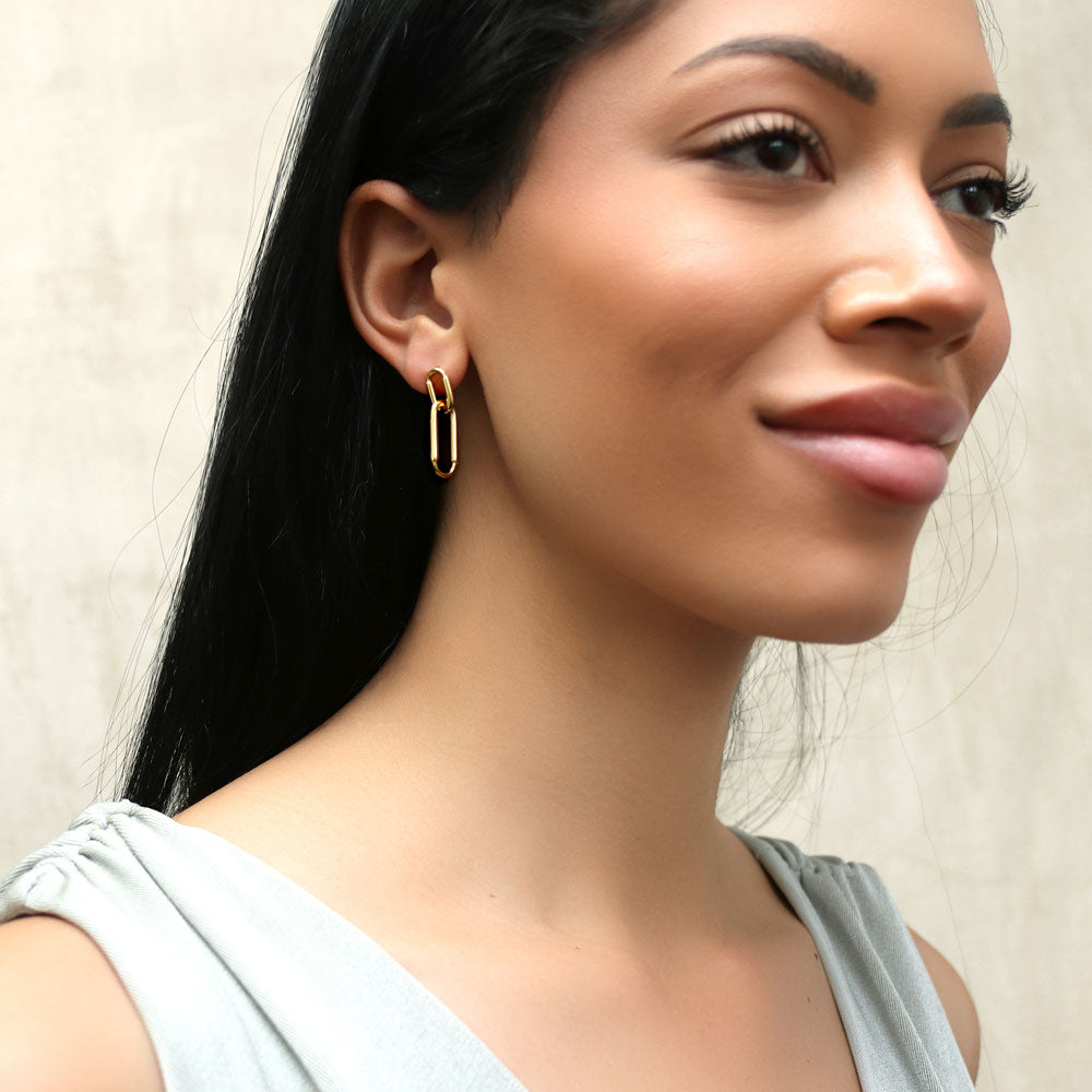Model wearing Paperclip Interlocking Dangle Earrings in Sterling Silver, 6 of 10