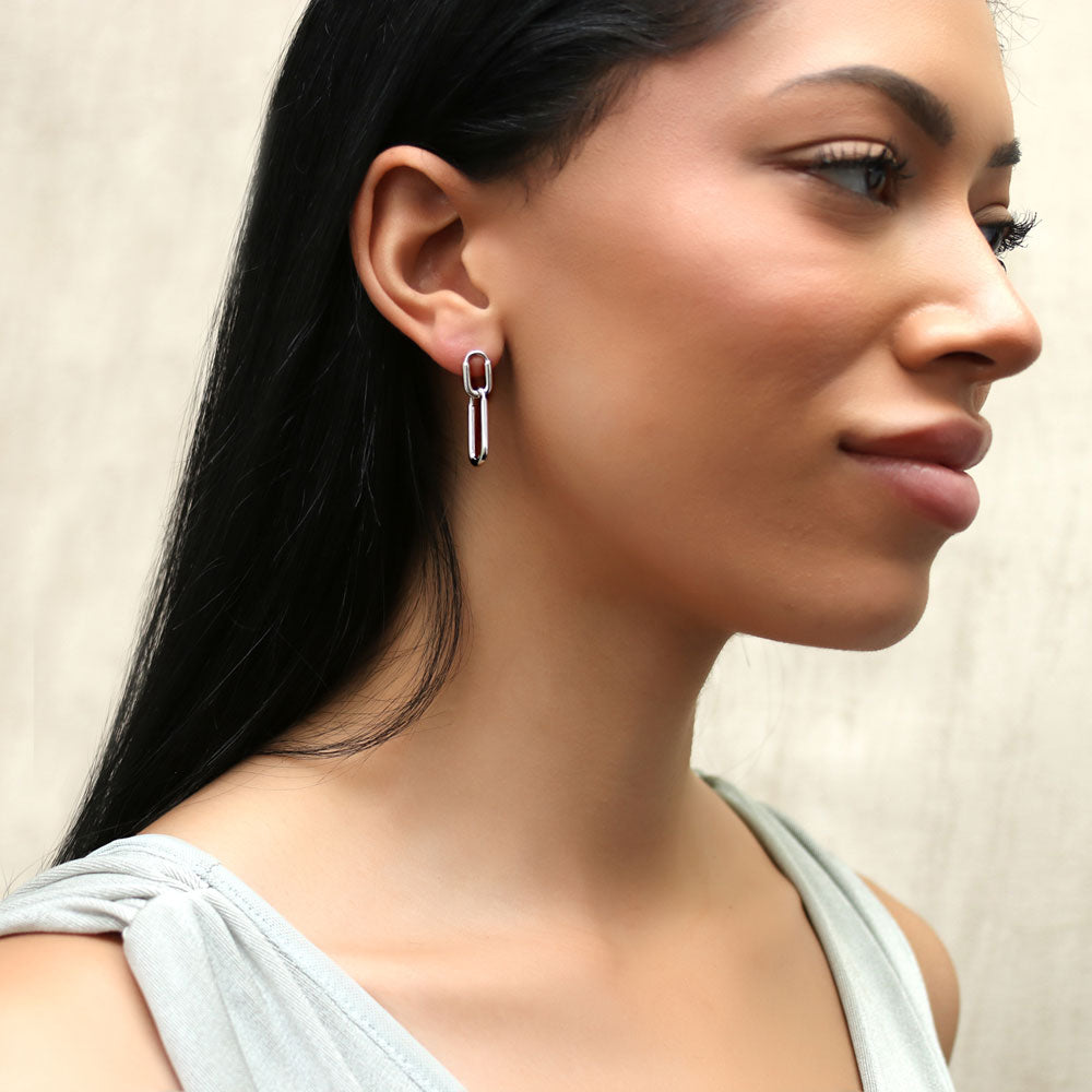 Model wearing Paperclip Interlocking Dangle Earrings in Sterling Silver, 7 of 10