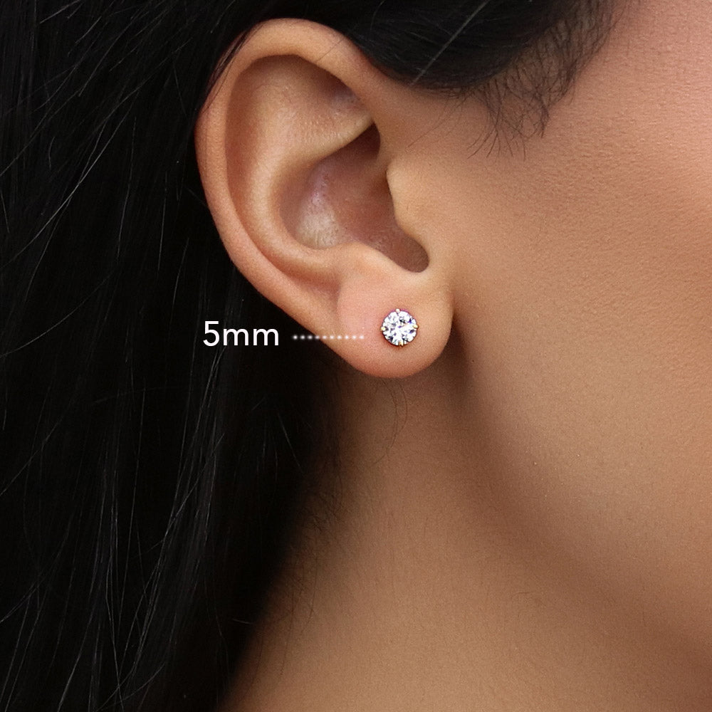 Model wearing Solitaire CZ Stud Earrings in Gold Flashed Sterling Silver, 5mm