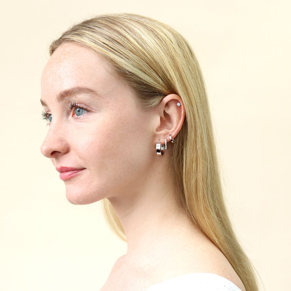 Model wearing Solitaire CZ Stud Earrings in Sterling Silver, 4mm