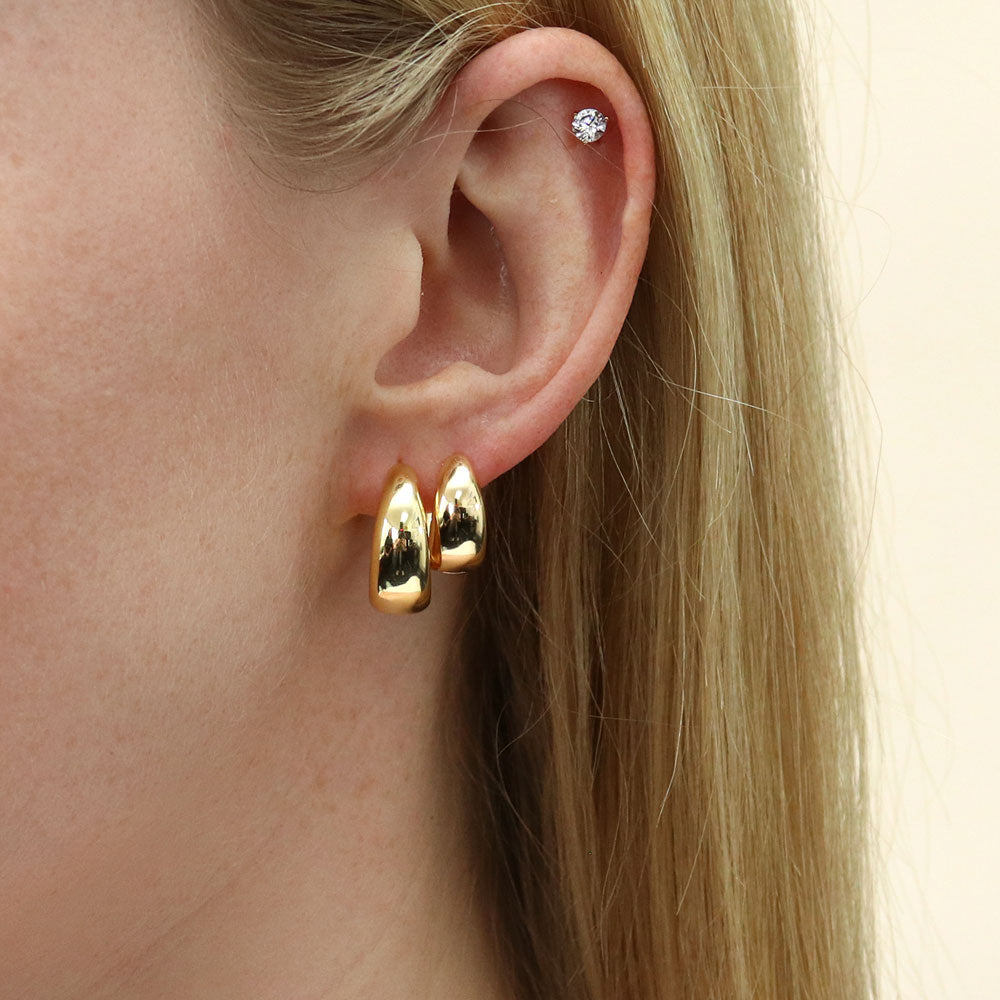 Model wearing Dome Small Hoop Earrings in Sterling Silver 0.8 inch, Yellow Gold Flashed