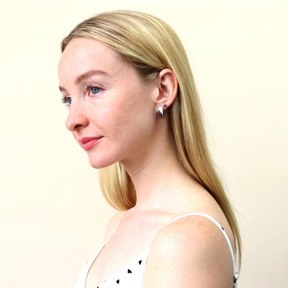 Model wearing Solitaire Black CZ Stud Earrings in Sterling Silver, 4mm