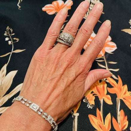 Model Wearing 3-Stone Split Shank Ring, Art Deco Chain Bracelet, Curved Half Eternity Ring