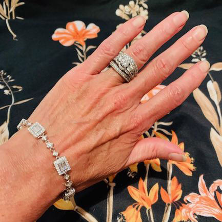Model Wearing 3-Stone Split Shank Ring, Art Deco Chain Bracelet, Curved Half Eternity Ring