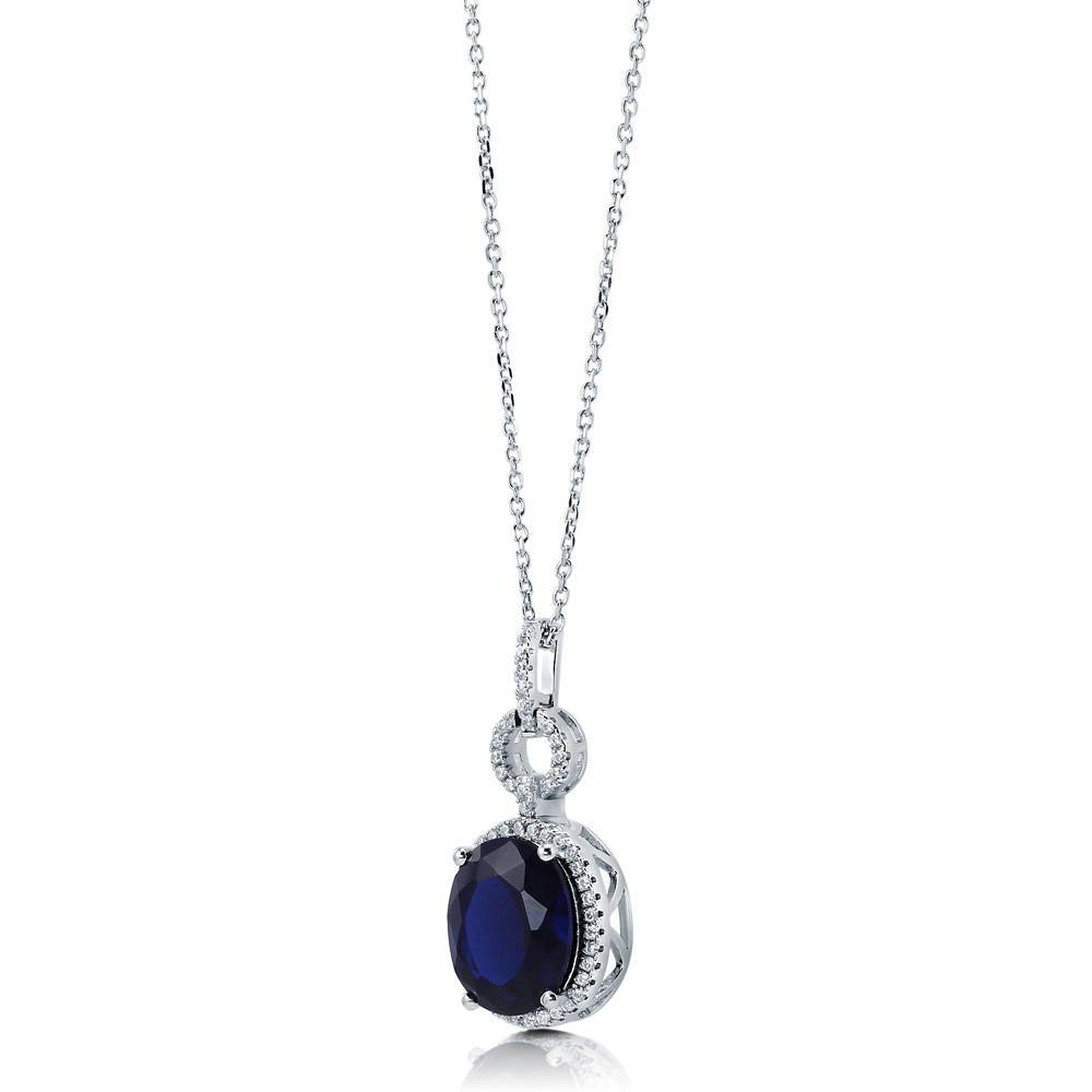 Halo Simulated Blue Sapphire Oval CZ Set in Sterling Silver