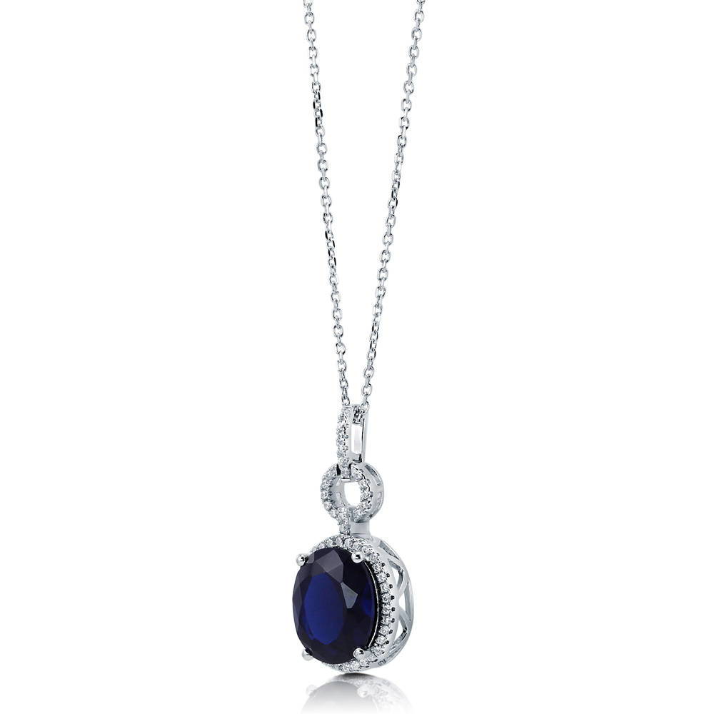 Angle view of Halo Simulated Blue Sapphire Oval CZ Set in Sterling Silver, 7 of 8