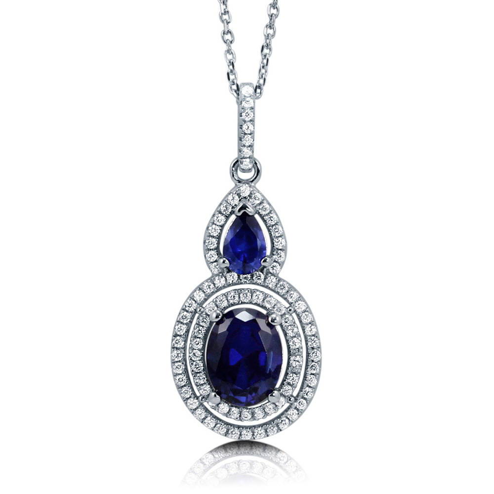 Halo Simulated Blue Sapphire Oval CZ Set in Sterling Silver