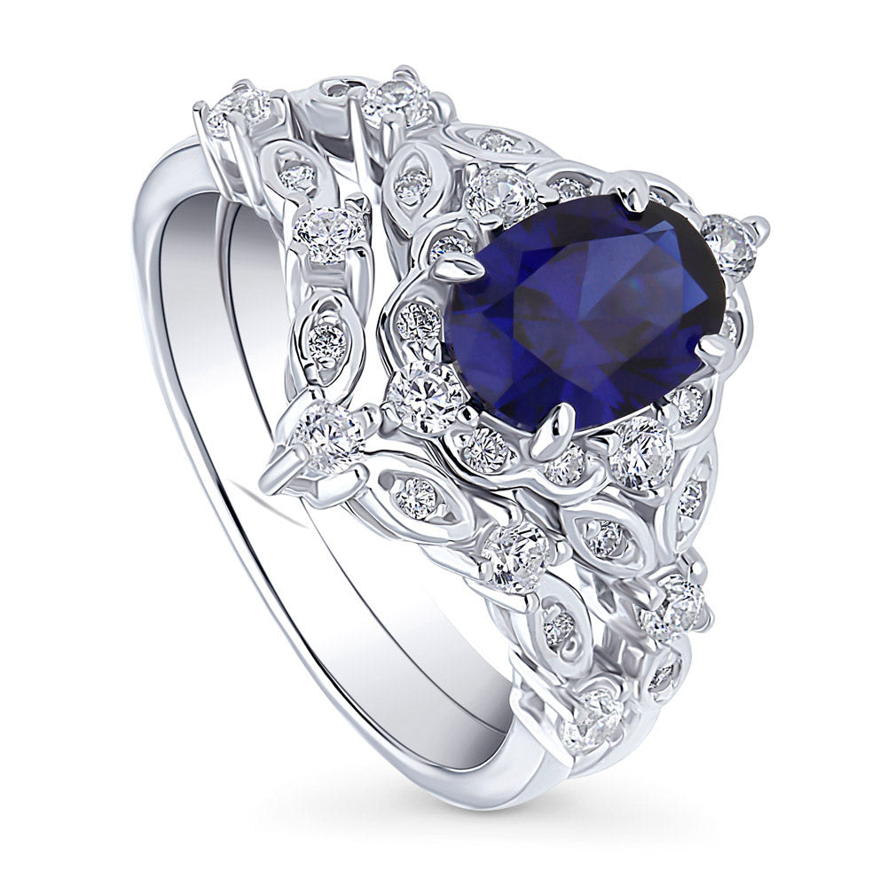 Chevron Halo Simulated Blue Sapphire CZ Ring Set in Sterling Silver