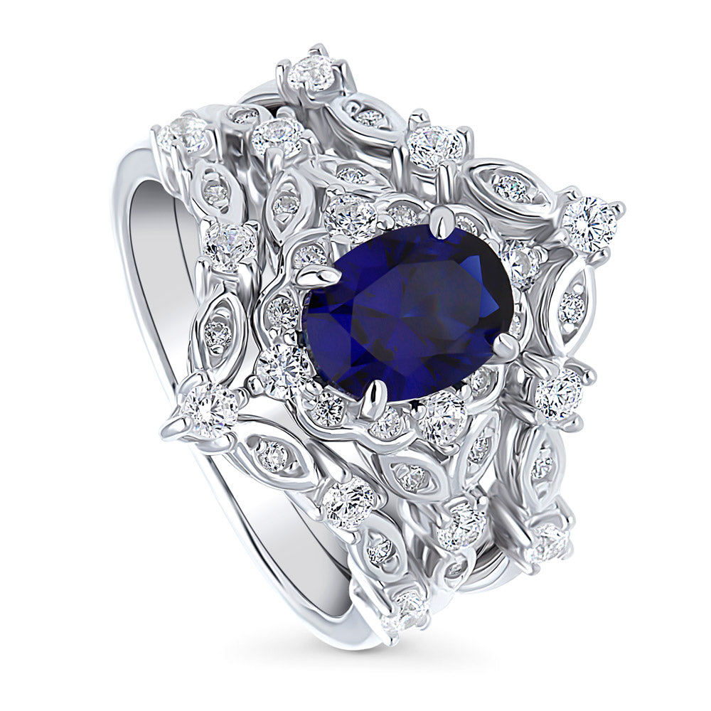 Chevron Halo Simulated Blue Sapphire CZ Ring Set in Sterling Silver
