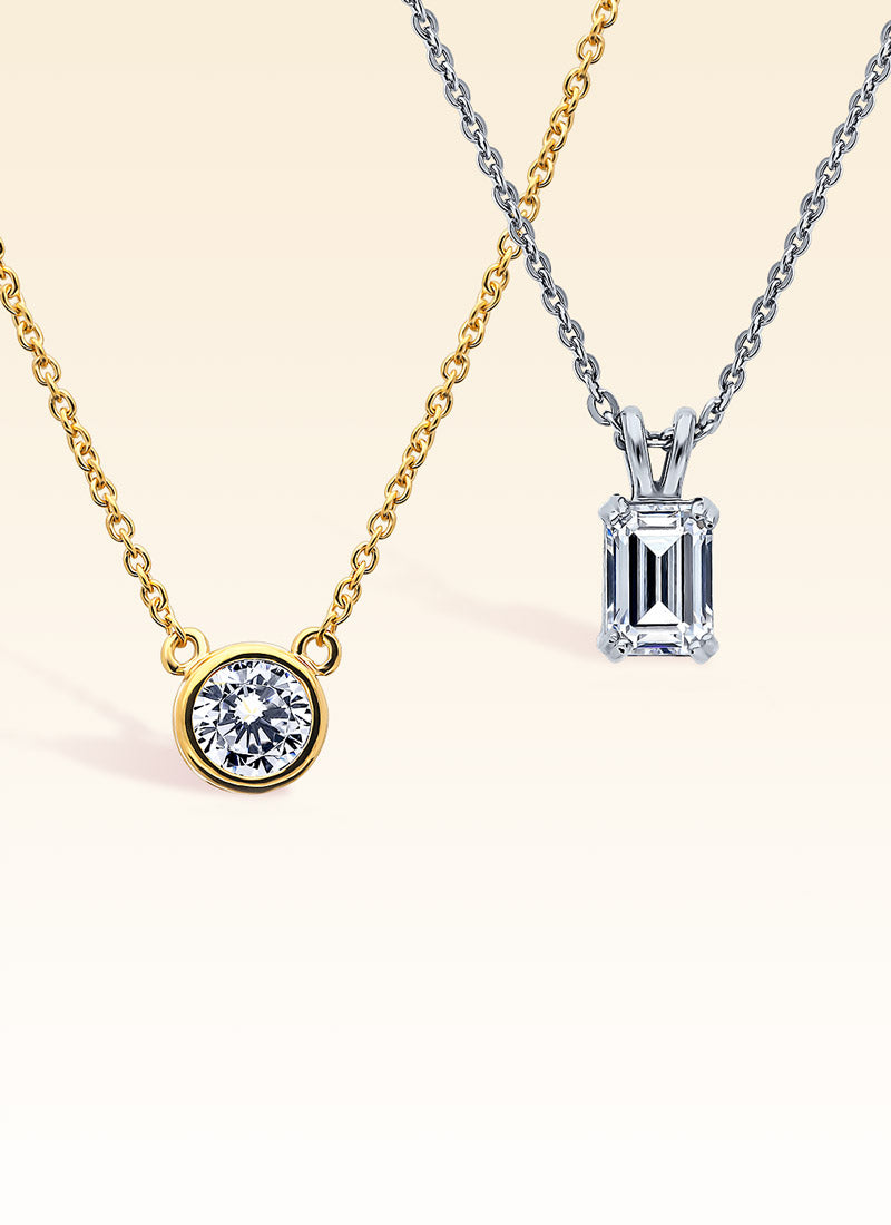 Gold flashed and silver solitaire necklaces.