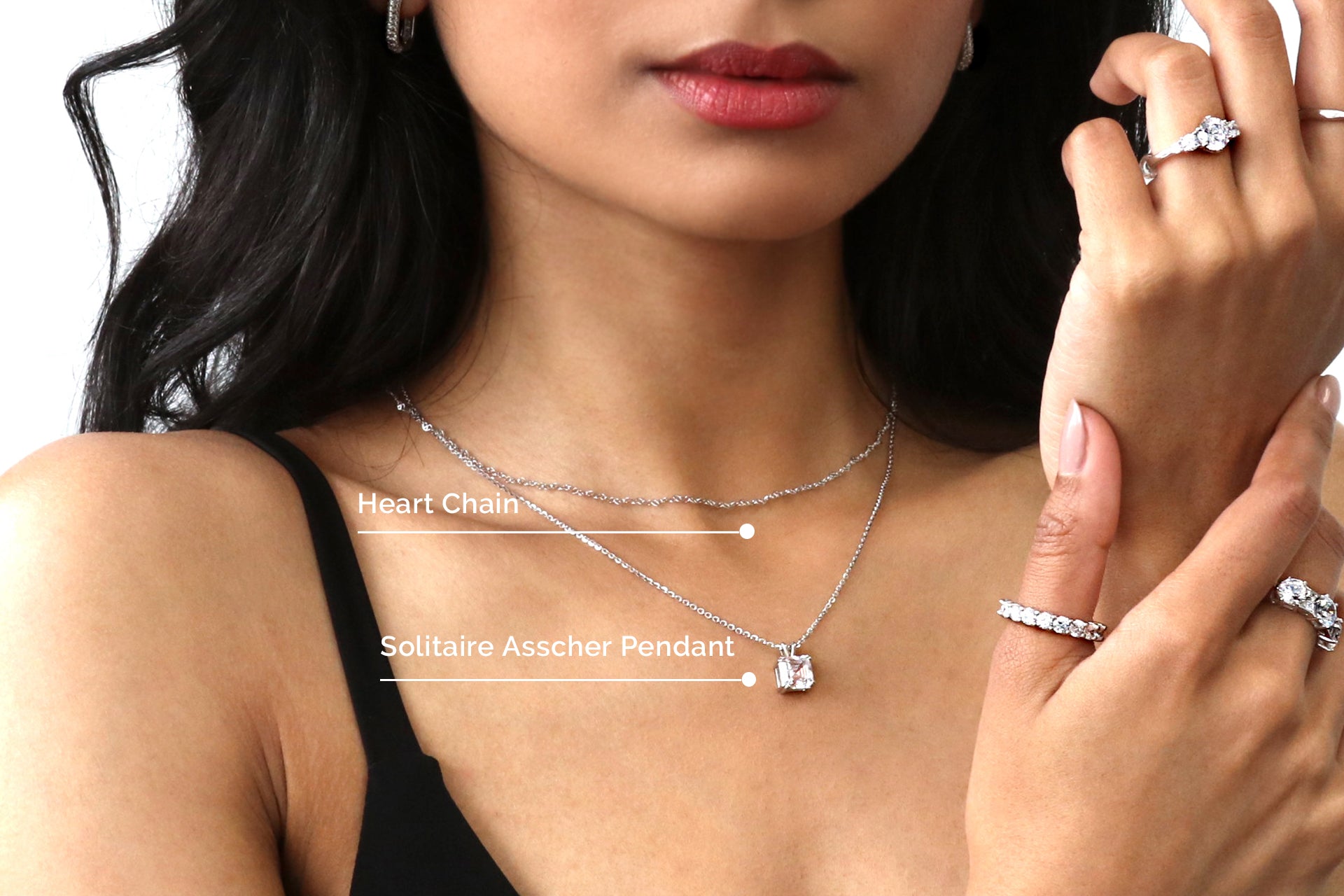 Model wearing layered chain necklace and pendant necklace