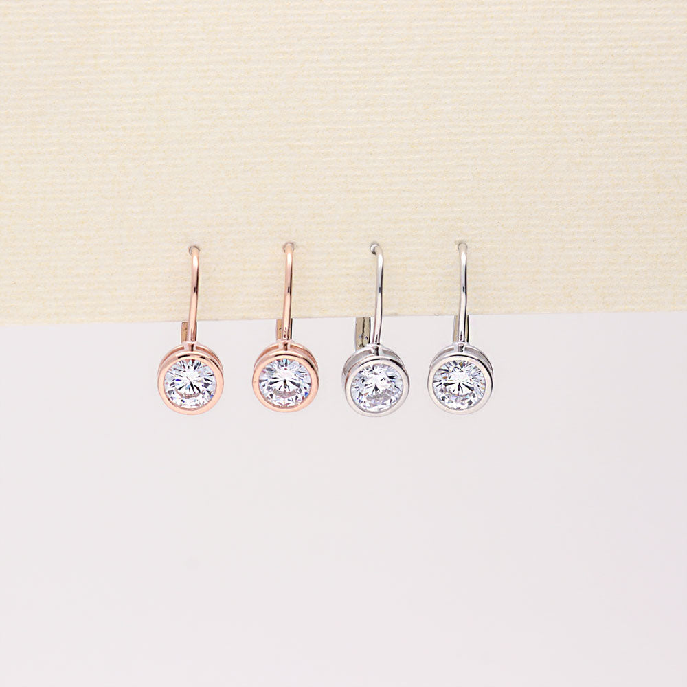 Flatlay view of Solitaire 1.2ct Bezel CZ Leverback Earrings in Sterling Silver, Yellow Gold Flashed