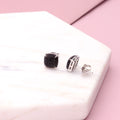 Flatlay view of Square CZ Stud Earrings in Sterling Silver, Blue Color