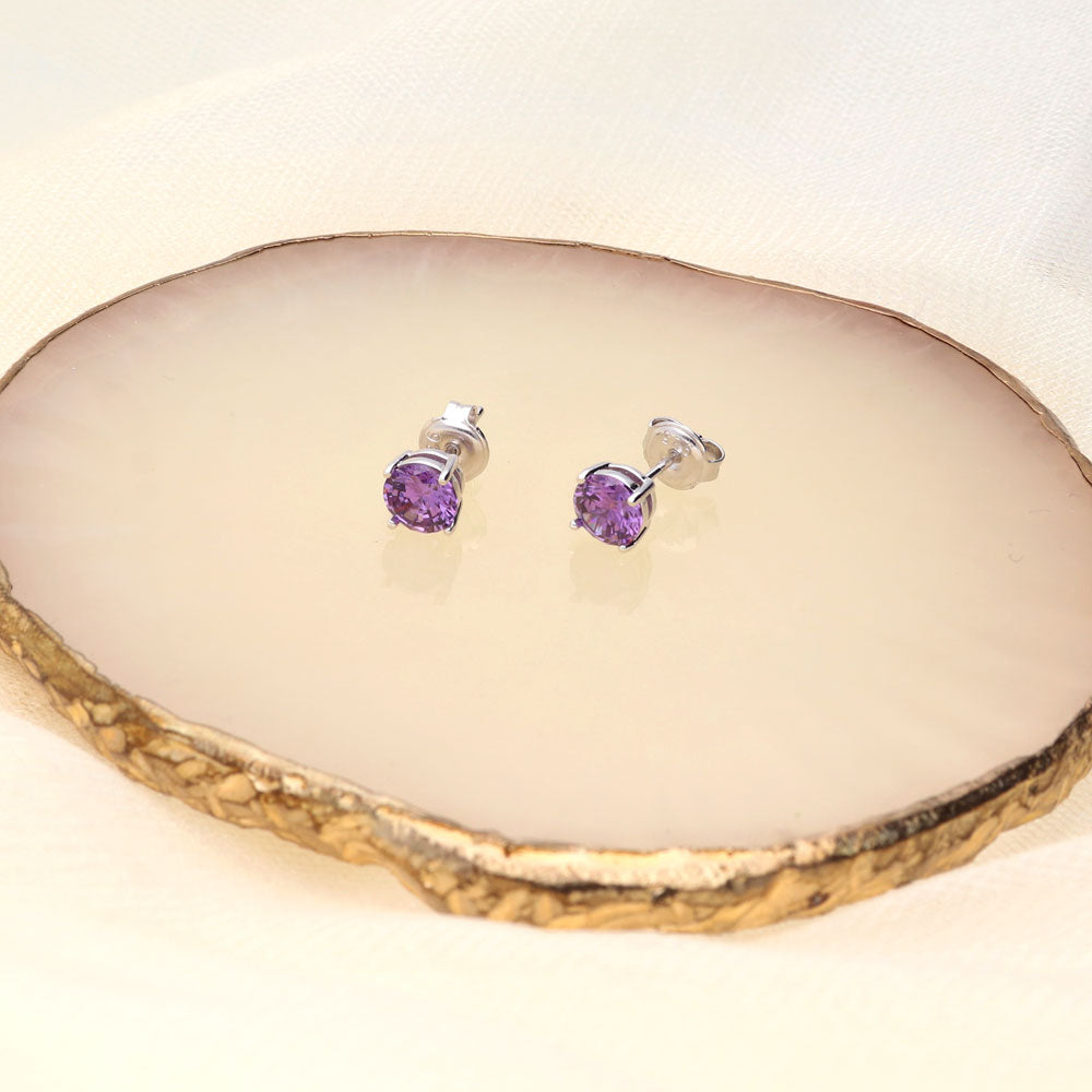 Flatlay view of Solitaire CZ Stud Earrings in Sterling Silver 1.6ct, Amethyst Color